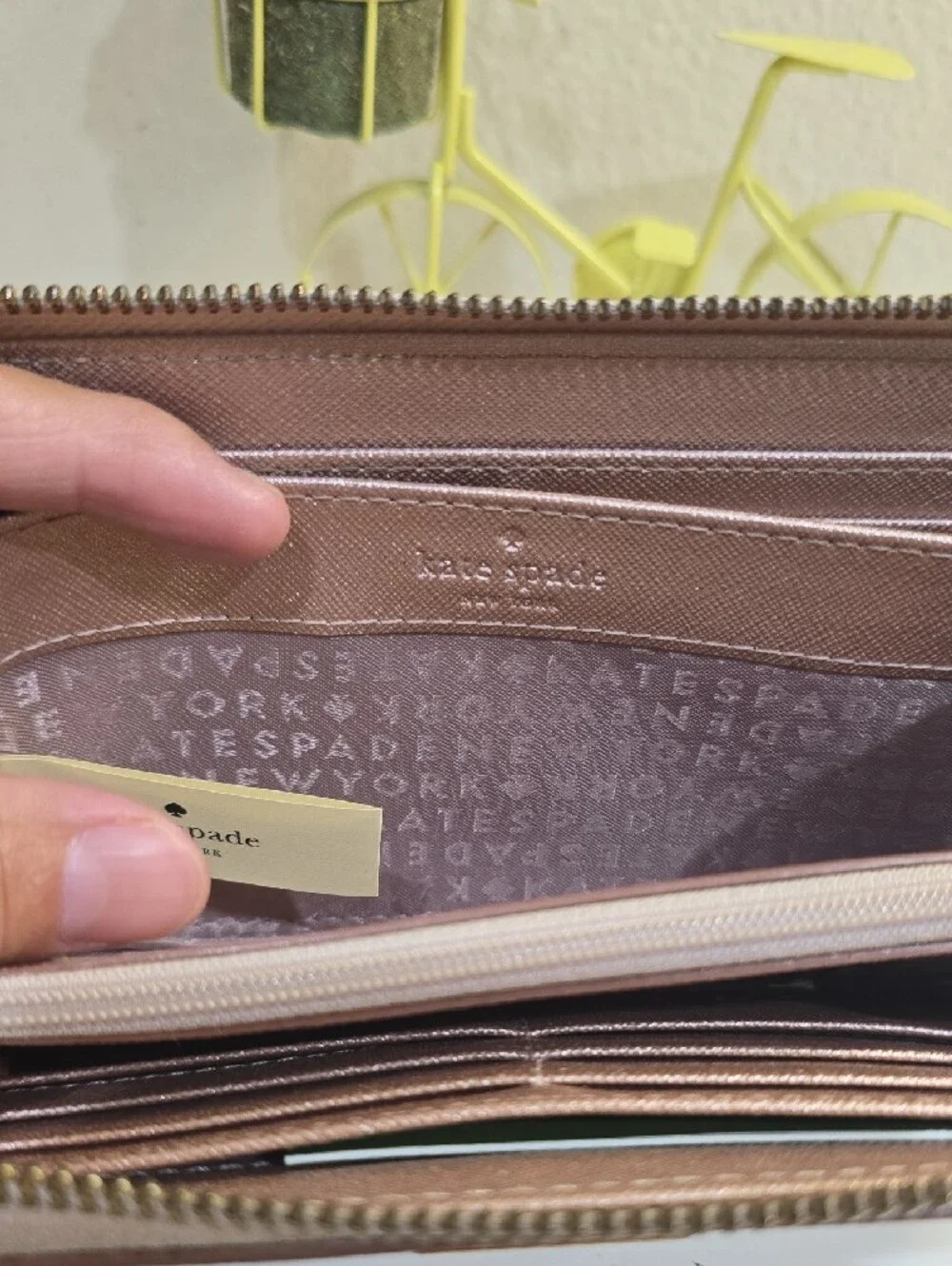 kate spade metallic rose gold zip-around continental wallet